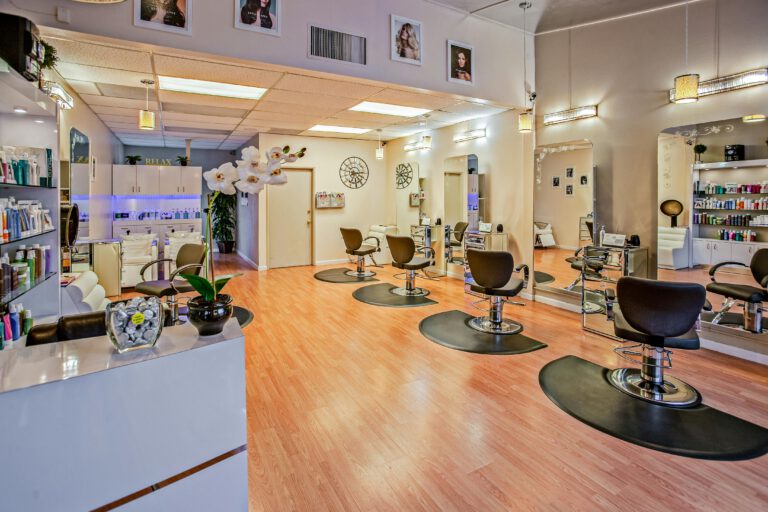 The interior of a hair salon with styling chairs and mirrors