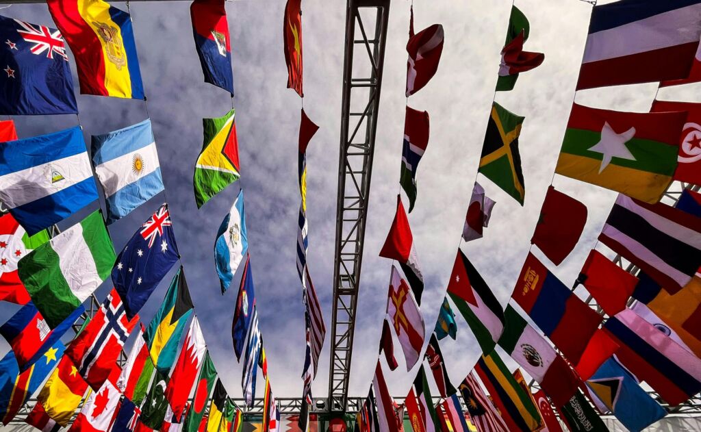 Rows of international flags against the sky