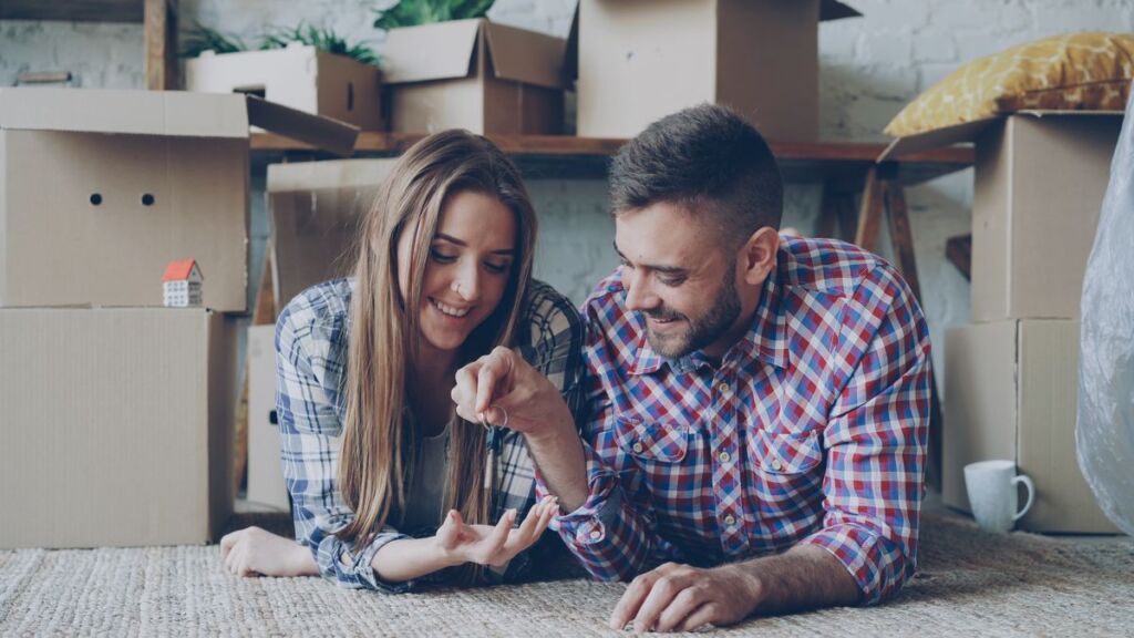 Couple holding the keys to their new home
