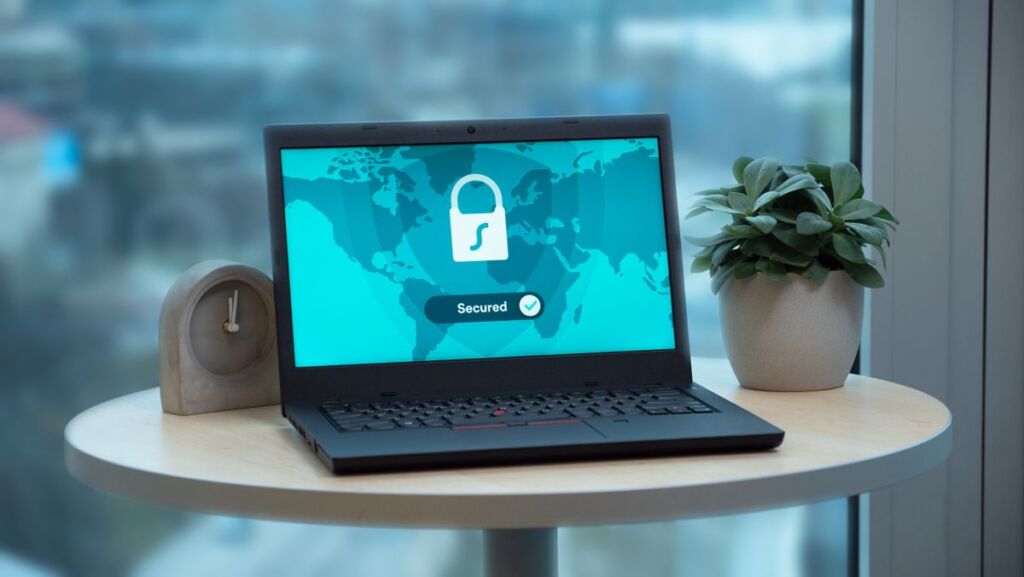 Laptop displaying a security lock icon, representing data protection