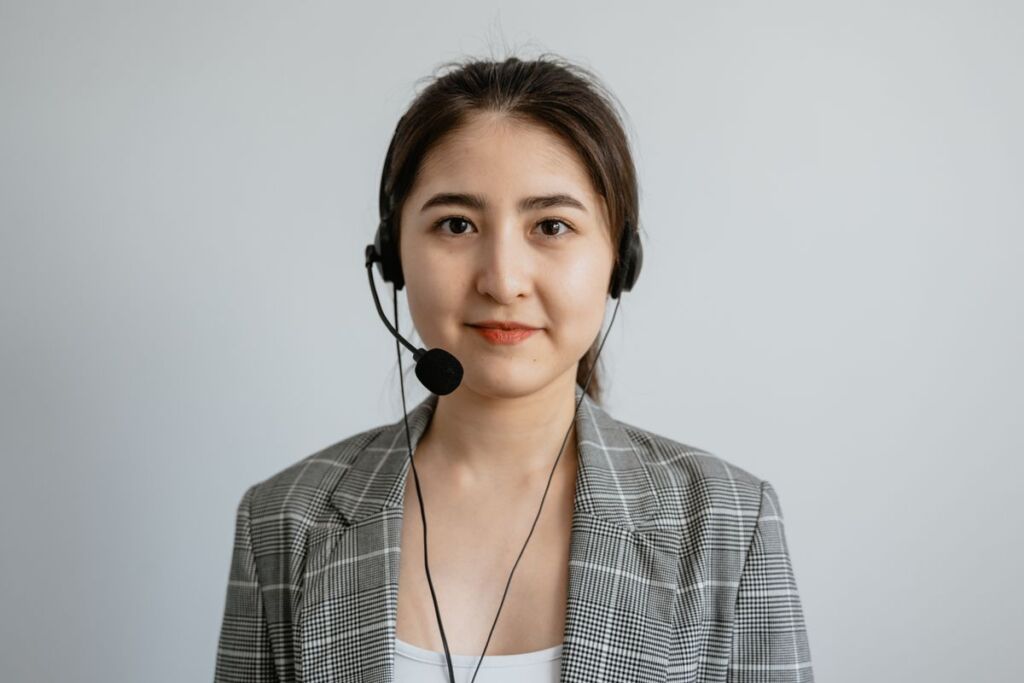Answering service agent taking a call at a workstation