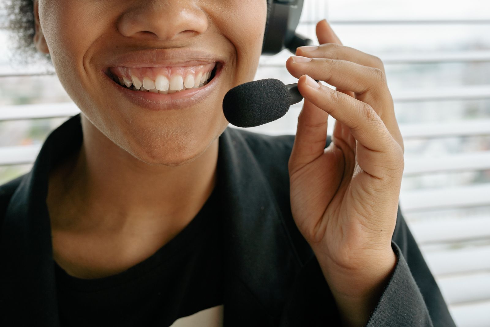 Smiling call center agent wearing a headset